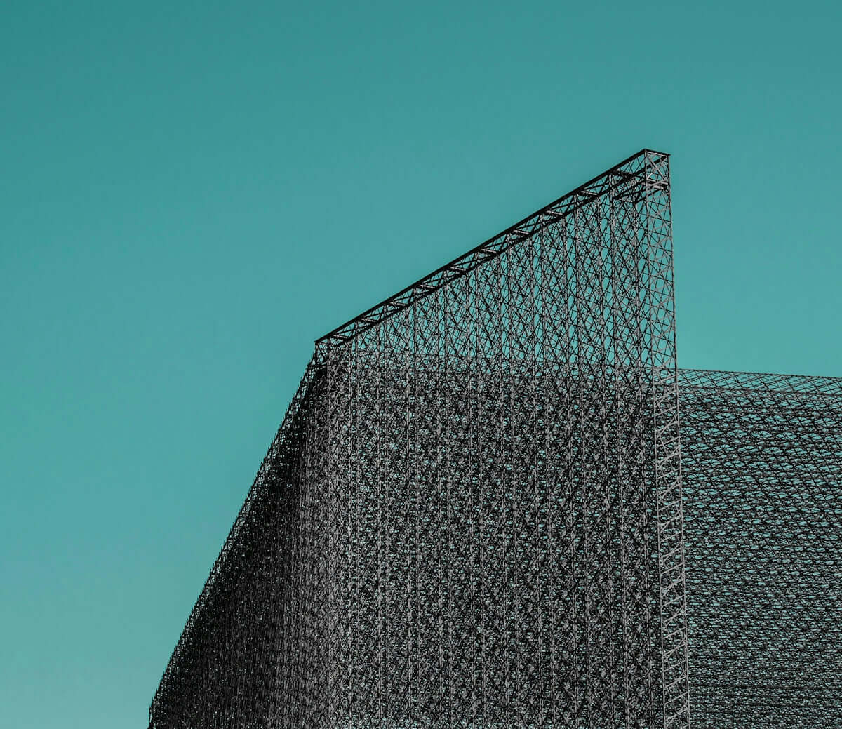 a large metal structure with a triangular roof