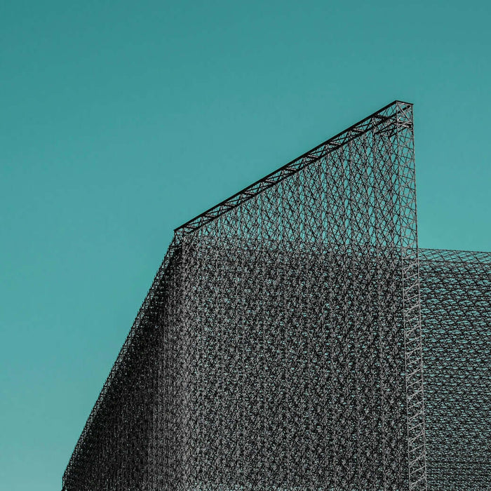 a large metal structure with a triangular roof