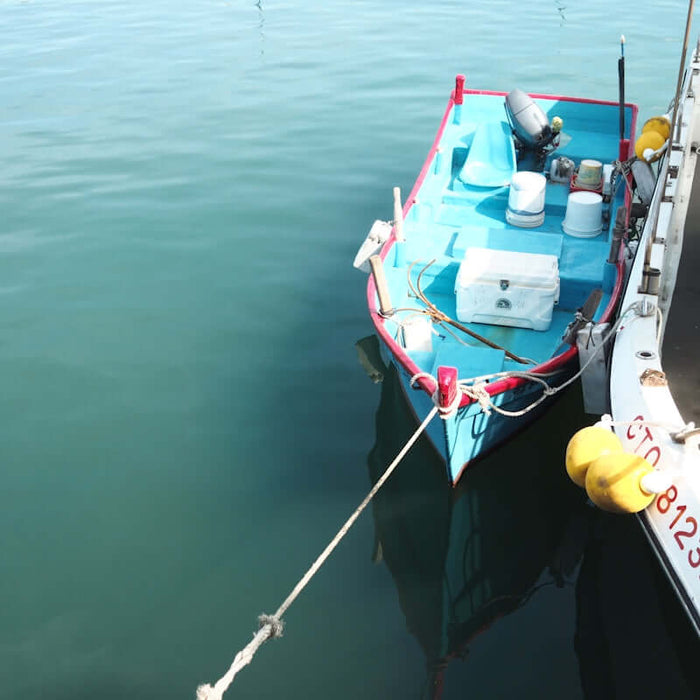 The 20m 30m 40m Set Net Buoy-Anchor Combo on a fishing boat in calm waters.