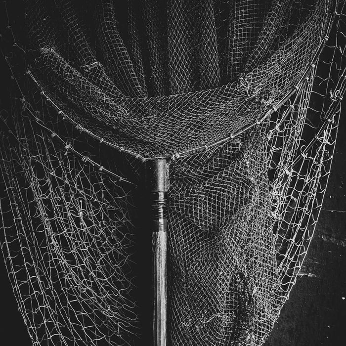Fishing Nets with 3 Inch 0.50mm x 36MD Pacific Island Mesh hanging in a black and white photo.