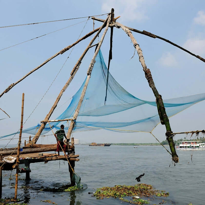 Selecting a 60m Net Buoy Anchor Combo for fishing nets with blue netting and wooden structure.