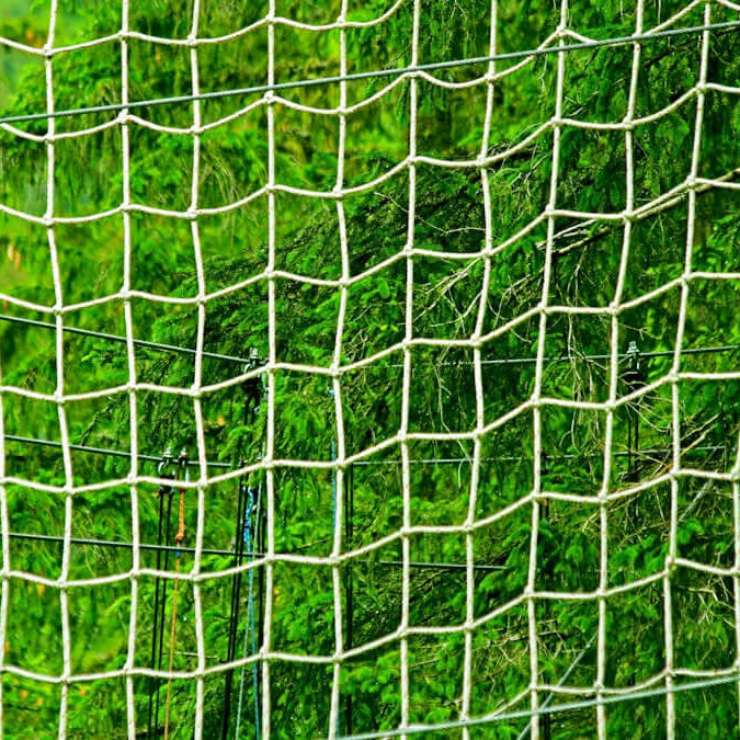 net mending twine green used for effective repairs in a lush green background.
