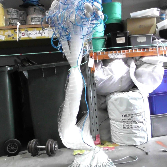 Fishing Long Net Guide showing a tangled fishing net in a storage area, ideal for learning expert techniques.