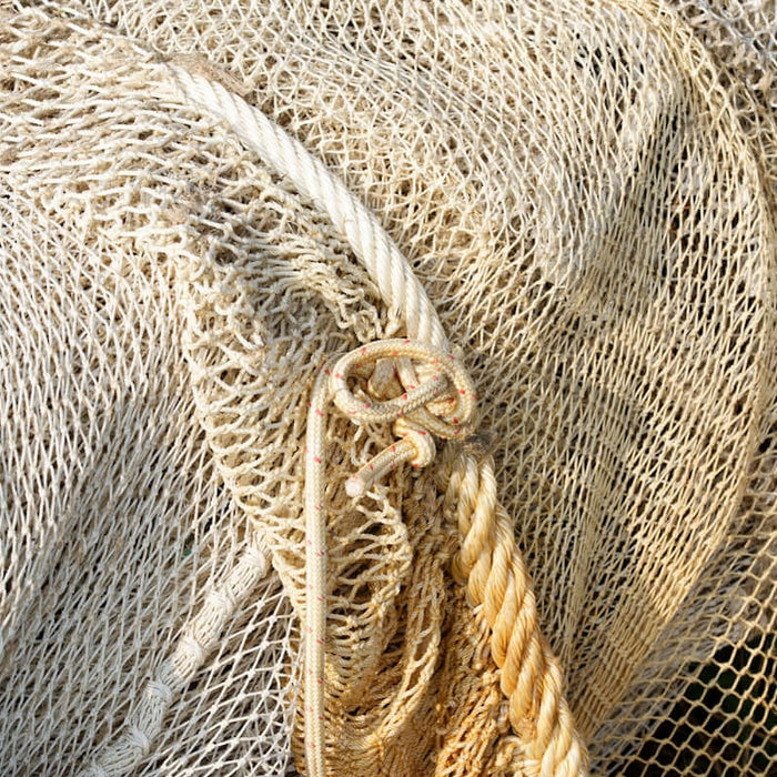 Close-up of 4 inch 0.7mm mesh nets used for fishing in Pacific Islands, showcasing the netting structure.