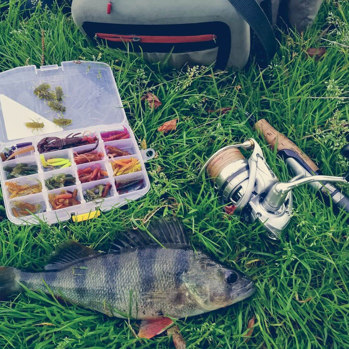 Hunting & Fishing Gear in New Zealand with a catch and tackle box on grass.