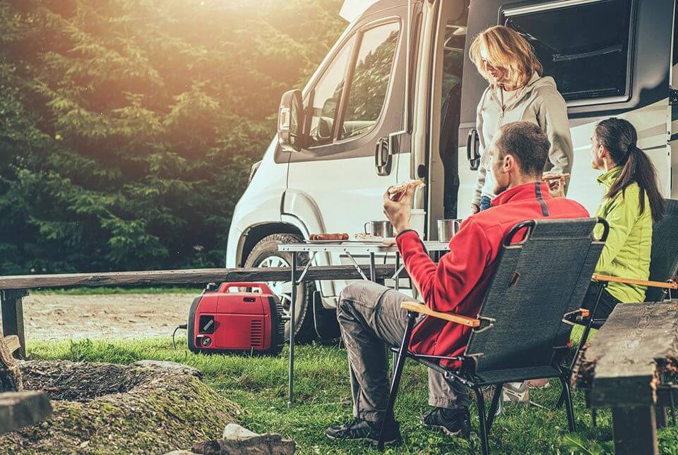 RV Supplies NZ essentials for comfortable camping with friends by an RV.