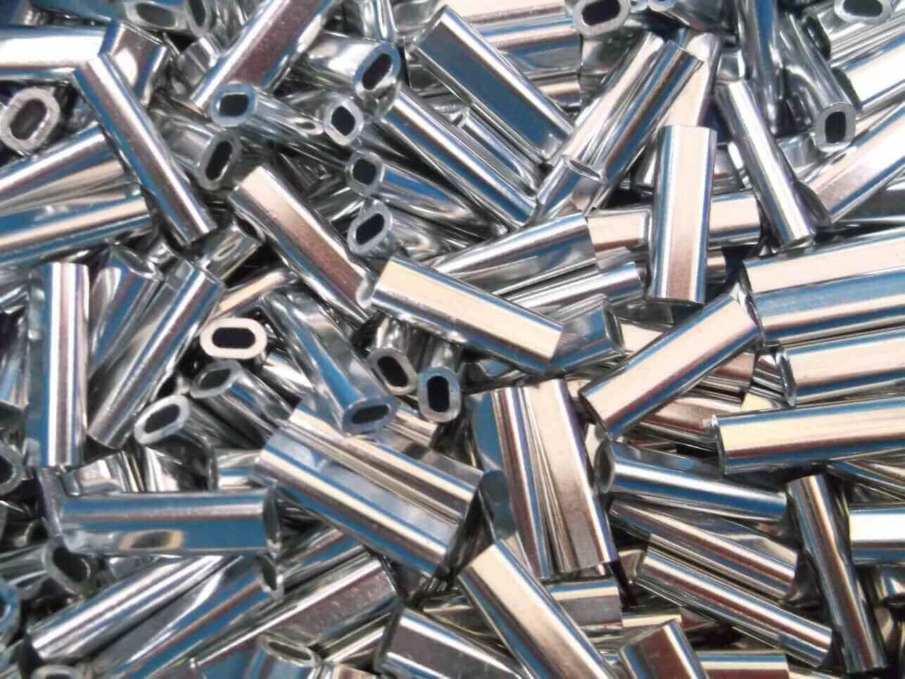 2mm Alli Crimps Size E for 1.8mm Nylon, metallic crimp tubes stacked together.