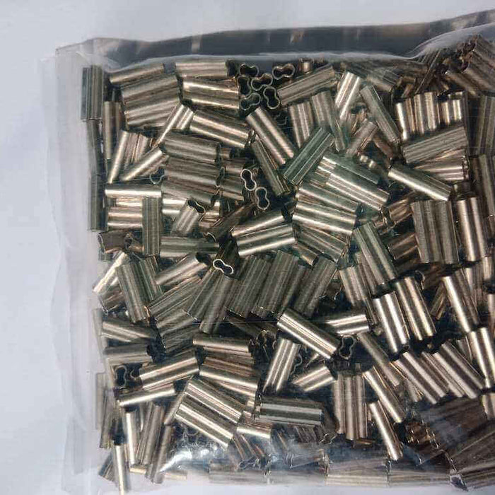 Essential Tips for Using 2.1mm Copper Crimps in a clear bag filled with multiple copper crimps for jewelry crafting.