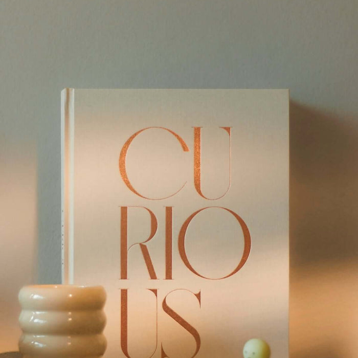 A book with the word curious on its cover.