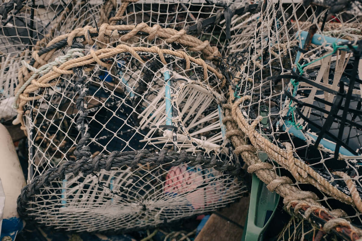 Using Flounder Mesh Multi Mono fishing gear piled together for sustainable fishing practices.