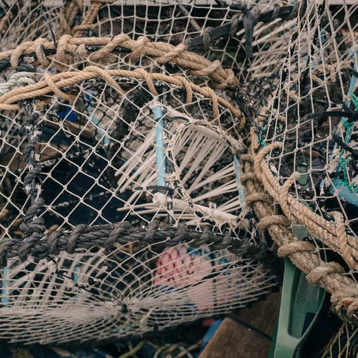 Using Flounder Mesh Multi Mono fishing gear piled together for sustainable fishing practices.