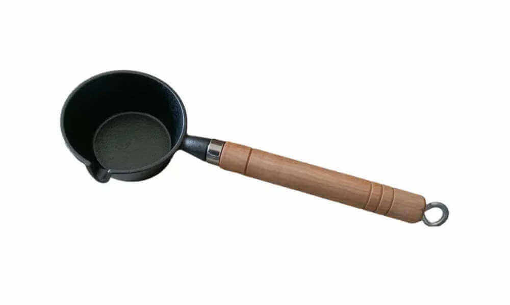 Cast Iron Ladle27 featuring a wooden handle for safe and comfortable use in your cooking adventures.