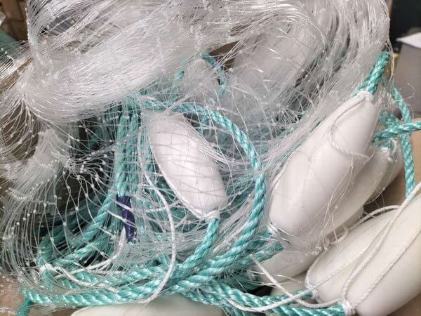 Whitebaiting Gear Essentials in New Zealand with nets and floats stacked together.