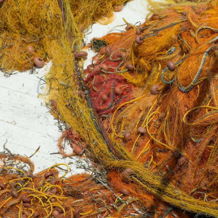Pile of tangled fishing nets with floats