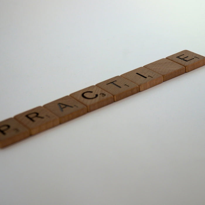 brown wooden ruler on white surface