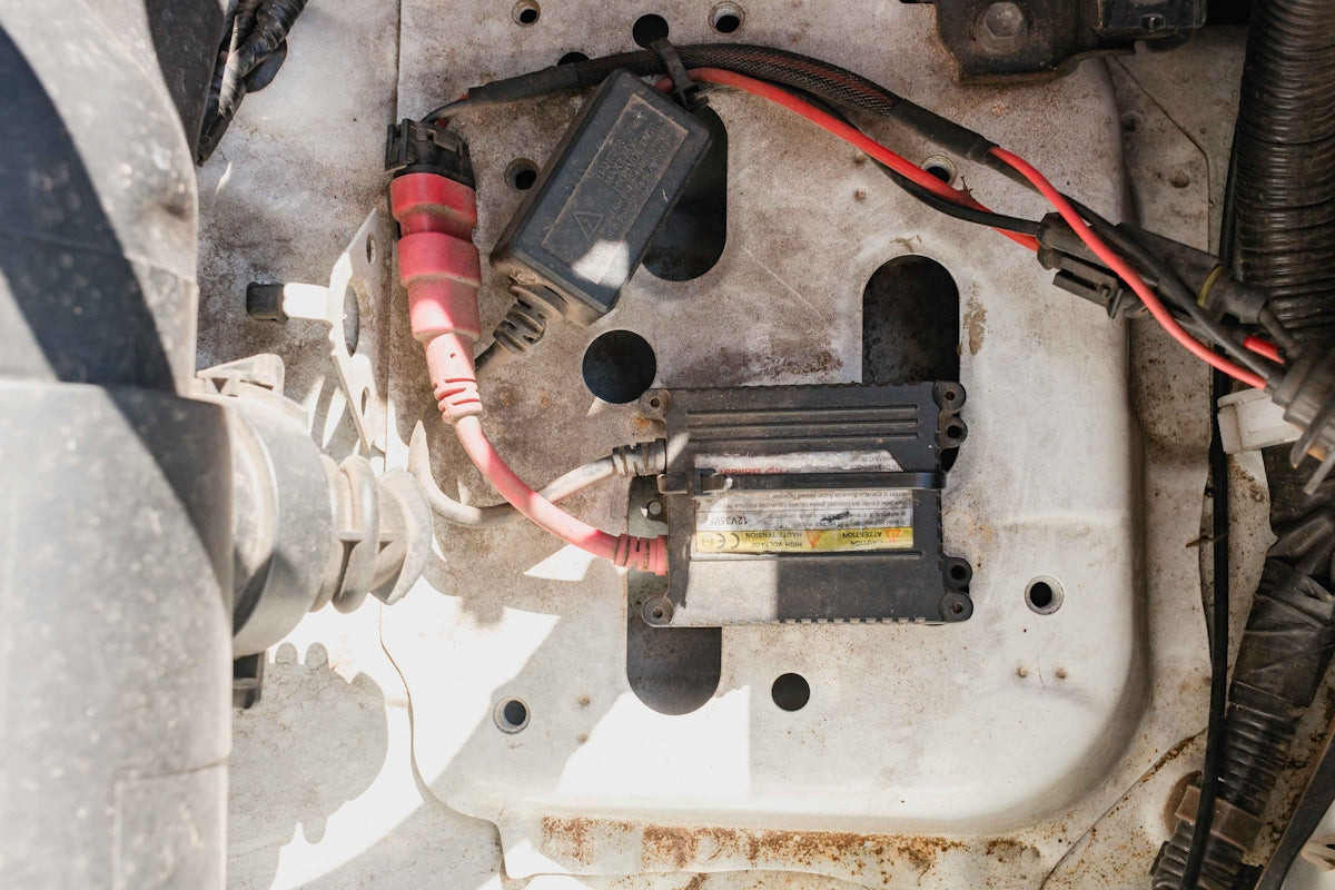a close up of a car's battery and wires
