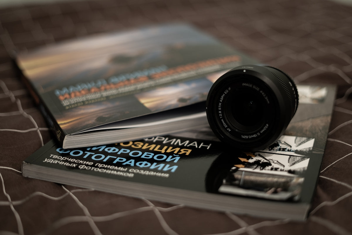 Books about photography with a camera lens.